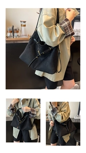 Détails de la bandoulière en cuir réglable et des boucles dorées sur le sac fourre-tout