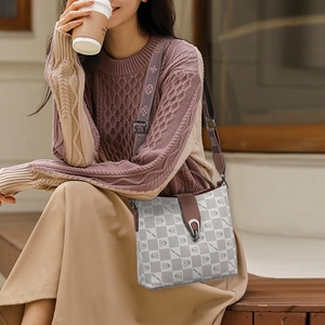 Vintage bucket bag with teddy bear pattern and decorative wide floral shoulder strap