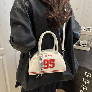 White Los Angeles 95 bowling bag styled with a black leather jacket for women