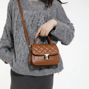 Classic brown quilted crossbody bag with gold twist lock and top handle for women