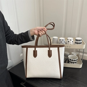 White woven tote bag with brown leather handles and large capacity for women