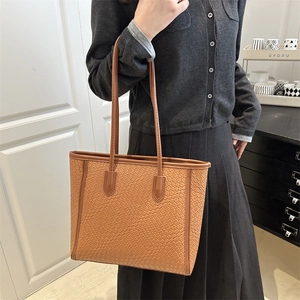 Brown woven pattern tote bag with large capacity and shoulder straps for daily commute