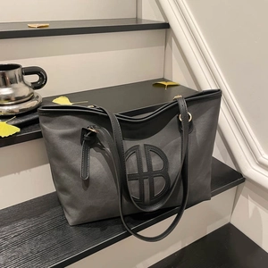Large dark grey canvas tote bag with creative B-logo and premium leather straps
