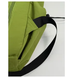 Detail of reinforced triangular stitching on durable nylon shoulder straps of backpack