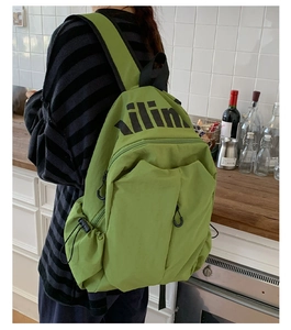 Detailed back view of a light green large capacity backpack with ilin logo for travel