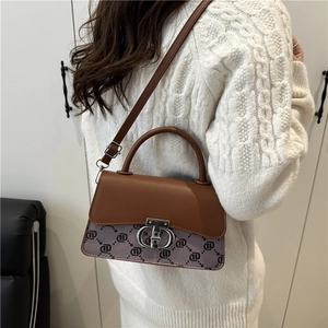 Vintage style brown and lavender patchwork crossbody bag with metallic turn-lock closure