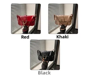 Glossy patent leather shoulder bags in red, khaki, and black with golden U-shaped buckles