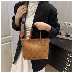 Detail of brown plaid tote bag with wide geometric strap and LNBOE lettering print