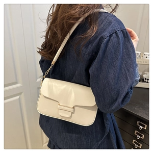 French retro cream shoulder bag with gold chain strap shown on model for daily commute