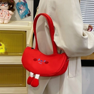 Cute red canvas shoulder bag featuring embroidered cartoon face and plush legs with shoes