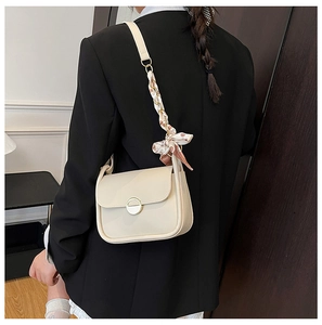 Chic beige underarm bag with gold clasp and decorative pink floral silk scarf on strap