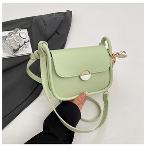 Light green PU leather shoulder bag with a metal twist lock and floral silk scarf detail