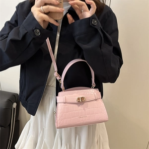 Pink crocodile pattern crossbody bag with gold hardware and top handle for women