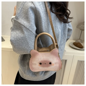 Detail of cute cat shaped crossbody bag showing gradient color and handle strap