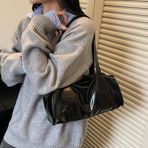 Glossy black patent leather baguette shoulder bag with retro minimalist design