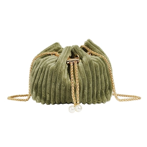 Green corduroy drawstring bucket bag with gold chain strap and pearl charms