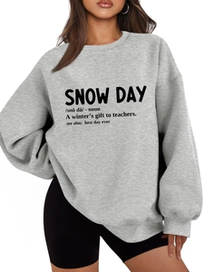 Detailed view of oversized grey fleece sweatshirt with snow day definition print