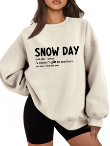 Detail of drop shoulder beige hoodie featuring snow day dictionary definition print