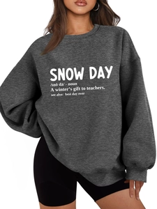 Close-up of snow day noun print on a thick dark grey fleece sweatshirt