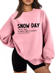 Close-up of pink oversized hoodie showing the Snow Day dictionary print and fabric texture