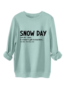 Detail of mint green sweatshirt featuring Snow Day dictionary definition print