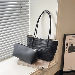 Minimalist black woven tote bag set with matching zipper pouch and long shoulder straps