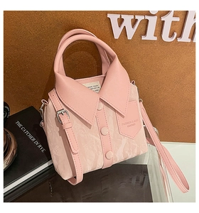 Detail shot of creative pink shirt-shaped tote bag with buttons and textured PU leather