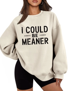 Detail of oversized drop shoulder sweatshirt with black 'I COULD BE MEANER' lettering