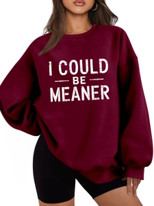 Detail of burgundy fleece sweatshirt with white I COULD BE MEANER artistic lettering