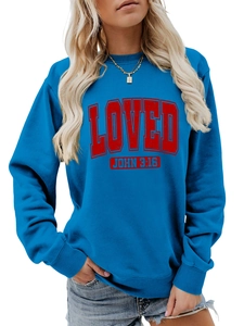 Detail of blue crewneck sweatshirt featuring red LOVED JOHN 3:16 text and ribbed cuffs