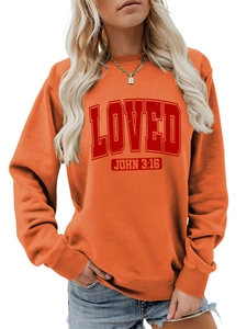 Detail of orange crewneck sweatshirt with red LOVED print and John 3:16 religious text