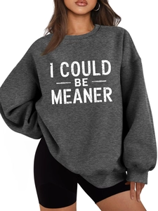 Detail of grey oversized sweatshirt showing I COULD BE MEANER print and thick fabric