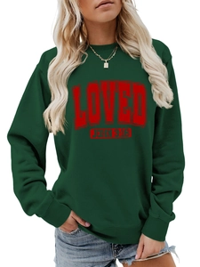 Detailed view of dark green crewneck sweatshirt with red LOVED JOHN 3:16 text print