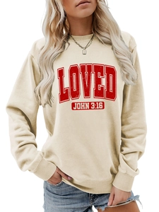Detail of ribbed crewneck and red vintage 'LOVED JOHN 3:16' print on beige sweatshirt