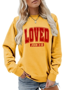Detail of yellow crewneck sweatshirt featuring red LOVED and JOHN 3:16 text print