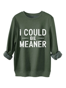 Close-up of thick fleece lining on dark green sweatshirt with I COULD BE MEANER print