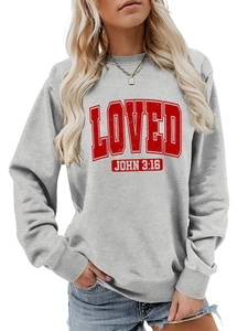 Detail showing the red collegiate LOVED print and ribbed crew neck of the gray sweatshirt