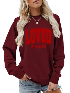 Detail of burgundy crewneck sweatshirt with red LOVED John 3:16 text and ribbed cuffs