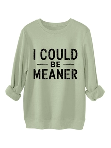 Detail of ribbed cuffs and I COULD BE MEANER print on the thick sage green sweatshirt
