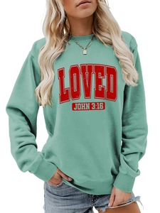 Detail of ribbed cuffs and red LOVED JOHN 3:16 print on mint green sweatshirt