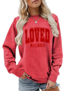 Detail of red crewneck sweatshirt featuring LOVED and John 3:16 bible verse print