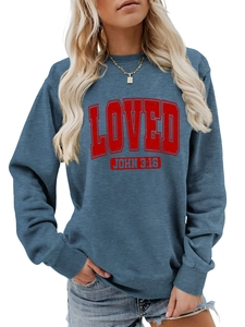 Detailed view of blue crewneck sweatshirt featuring red 3D LOVED John 3:16 text print