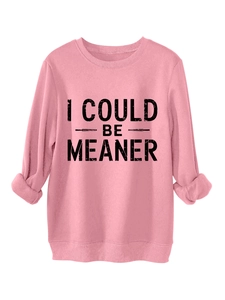Detail of soft pink fleece sweatshirt showing I COULD BE MEANER print and ribbed cuffs