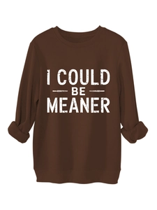Detail of white distressed I COULD BE MEANER lettering on brown cotton sweatshirt