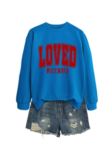 Detail of blue crewneck sweatshirt with red LOVED print and frayed denim shorts