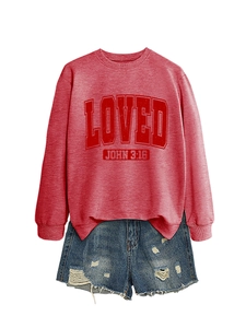 Flat lay of a dark red crewneck sweatshirt with LOVED JOHN print and denim shorts