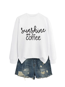 Detail of sunshine and coffee script print on white long sleeve crewneck sweatshirt