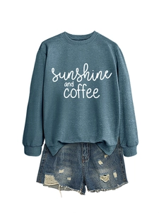 Detail of sunshine and coffee sweatshirt with vintage ripped denim shorts set