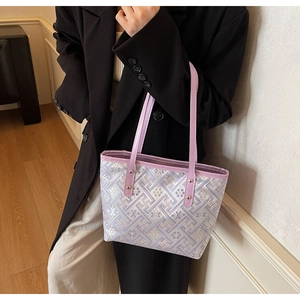 Close-up of the lavender jacquard tote bag with traditional geometric patterns and rivets