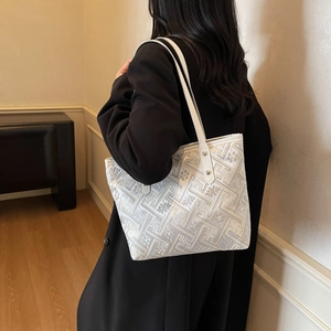 Ethnic style off-white tote bag with geometric maze pattern and long shoulder straps